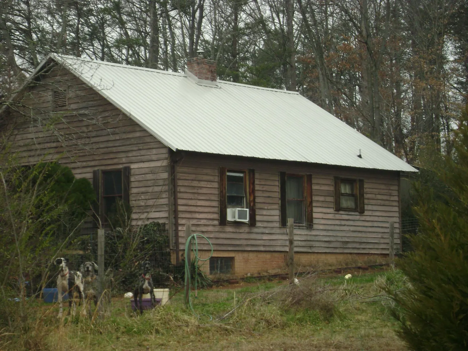 White metal roof on an old wood sided farmhouse, from a Metal Roof Installation job in New Knoxville